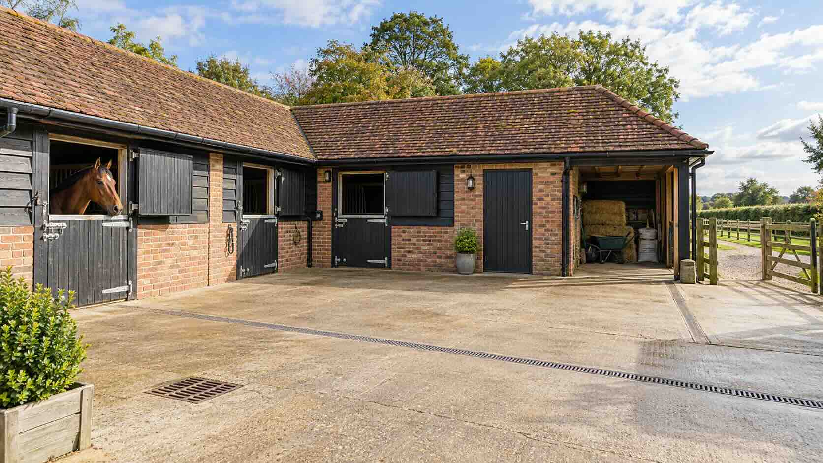 Illustrative private stable yard with storage and access to paddocks