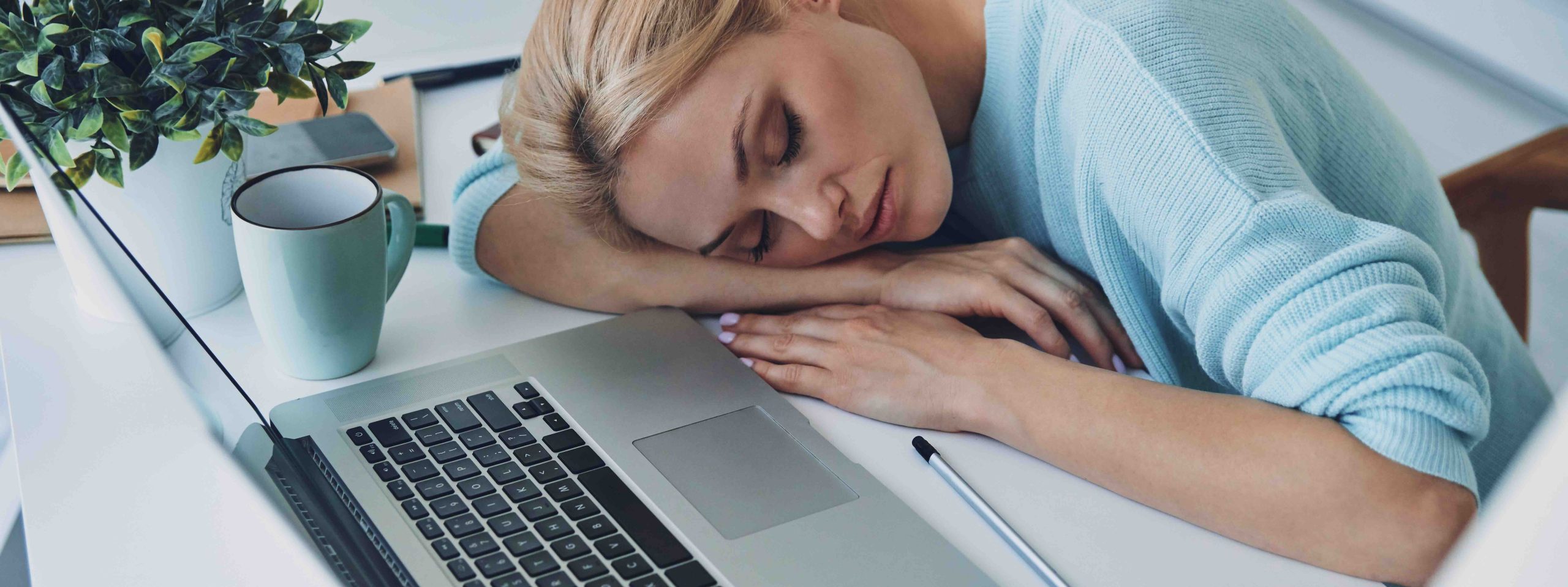 A lady a sleep at her desk from worrying too much at night and not sleeping - a reason why Buying Agent Simplifies £1m+ Moves
