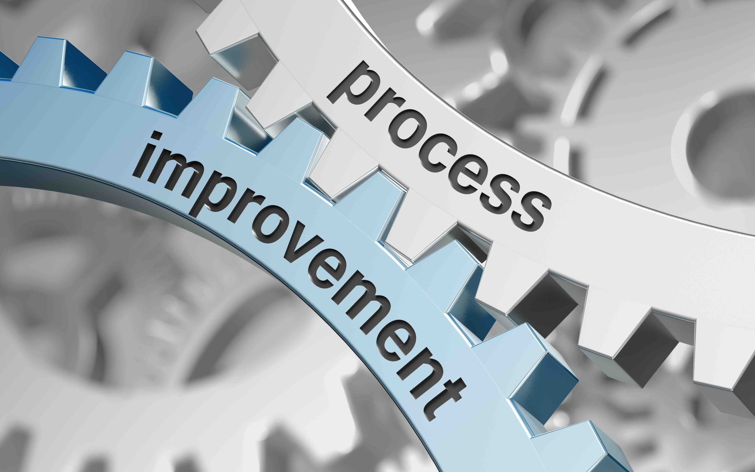 Two cogs - one saying improvement and the other saying process - this is the lead image of the blog The Process of Buying a House