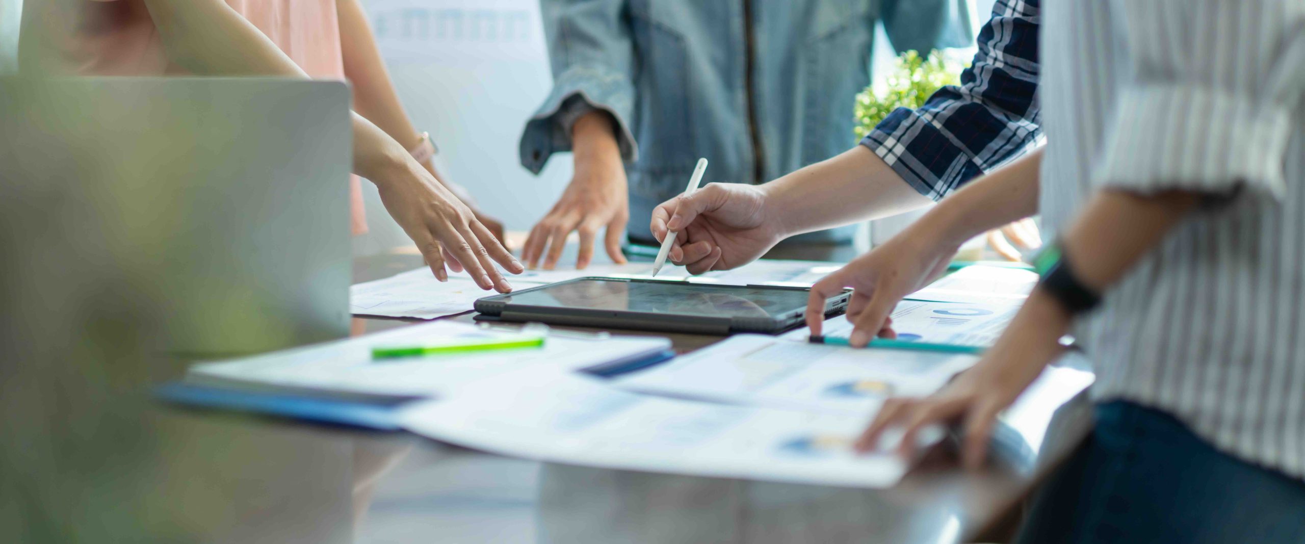 Investment Consultant,strategy,planning,Financial advisor and accounting concept.Group of business adviser meeting to analyze and discuss the situation on the financial report workplace office. People negotiating for the blog The Process of Buying a House