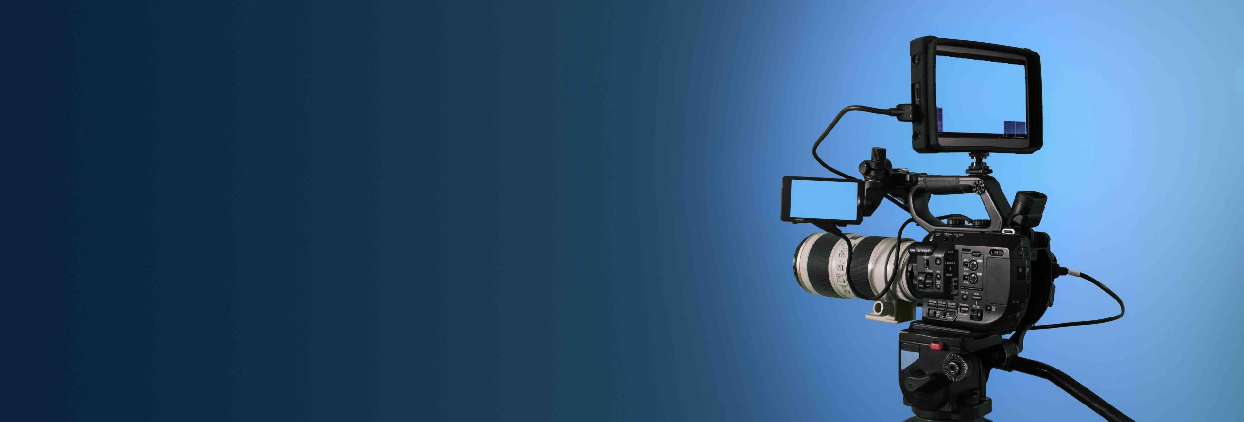 Professional video camera filming on dark abstract blue background, broadcasting banner with copy space A camera ready for a pre-view of a house - The Process of Buying a House